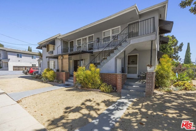 view of front of house with a balcony