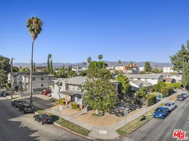 birds eye view of property with a mountain view