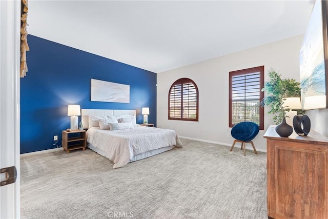 bedroom with light colored carpet