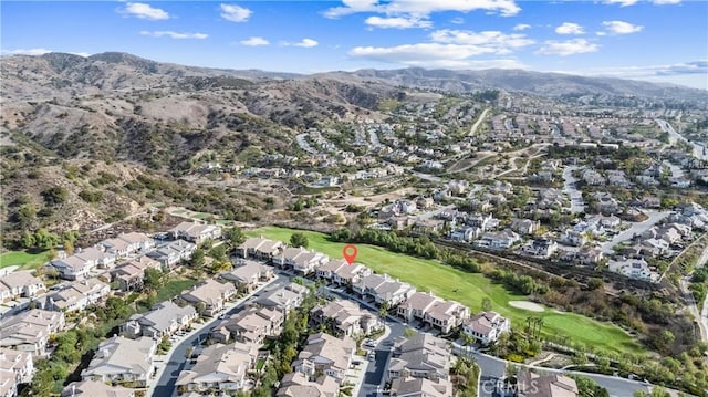 birds eye view of property with a mountain view