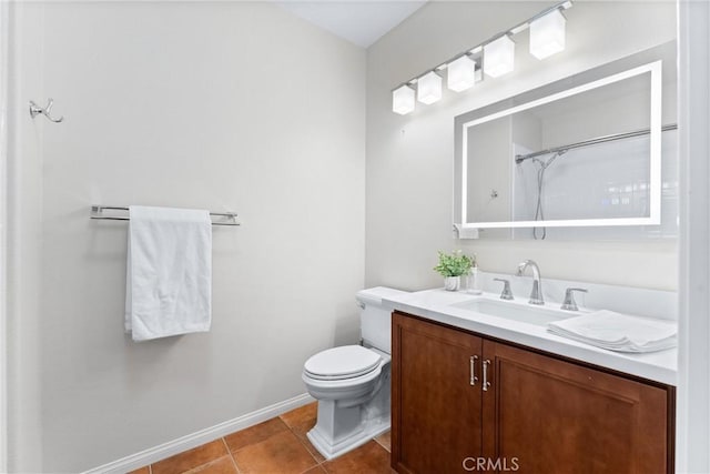 bathroom with toilet, vanity, tile patterned flooring, and a shower