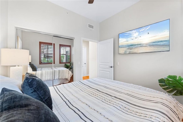 bedroom with ceiling fan and a closet