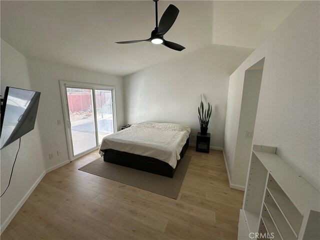 bedroom with ceiling fan, access to exterior, light wood-type flooring, and pool table