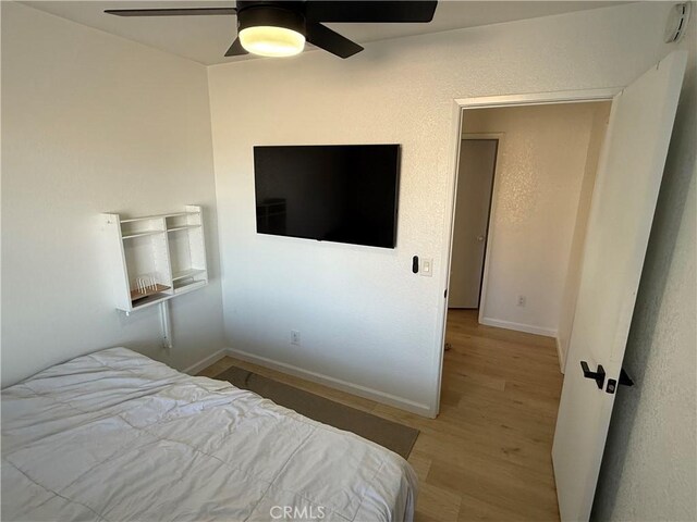 bedroom featuring ceiling fan and hardwood / wood-style flooring