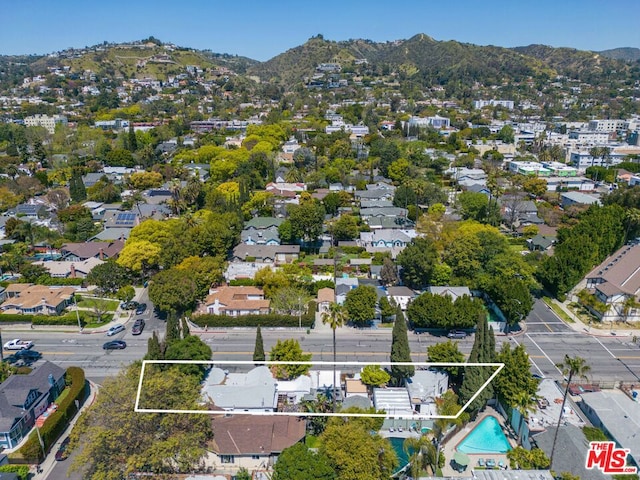 birds eye view of property with a mountain view