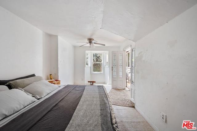 bedroom featuring ceiling fan and carpet