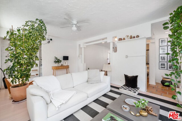 living room featuring ceiling fan