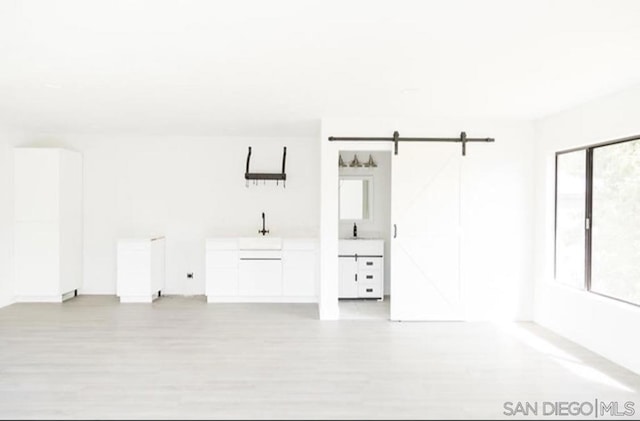 empty room featuring a barn door