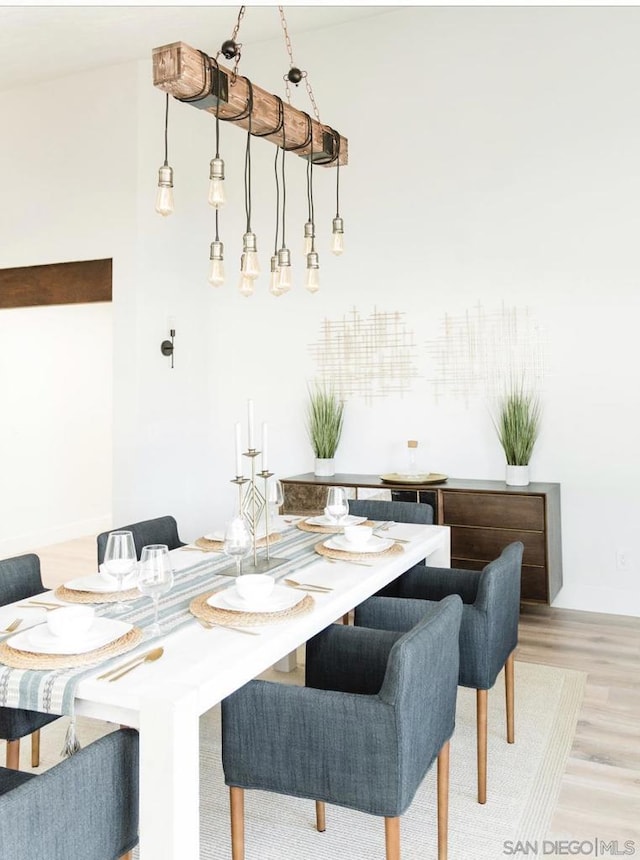 dining space featuring light wood-type flooring