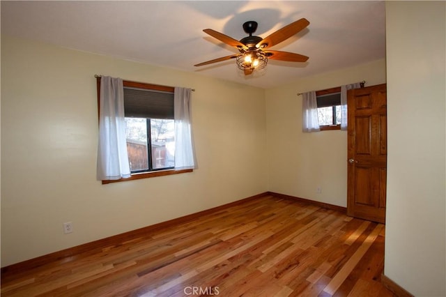 unfurnished room featuring light hardwood / wood-style floors and ceiling fan