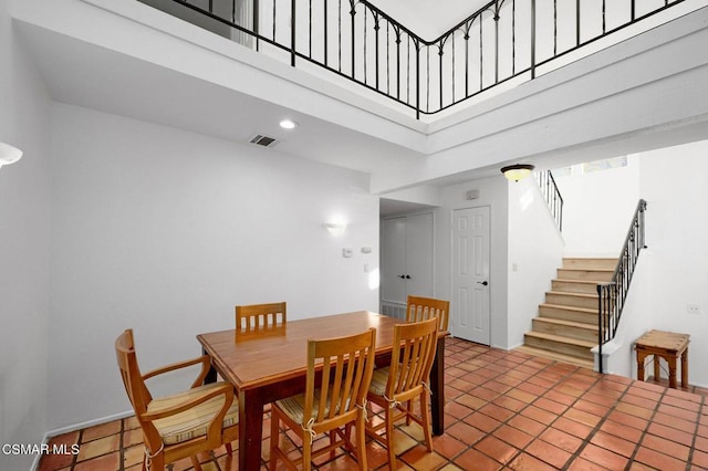 dining room featuring a high ceiling