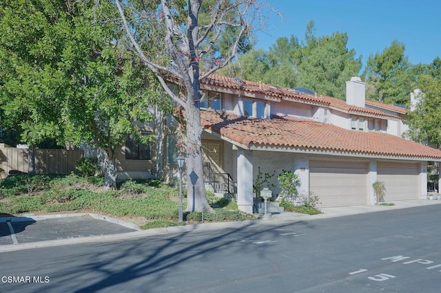 mediterranean / spanish-style house featuring a garage