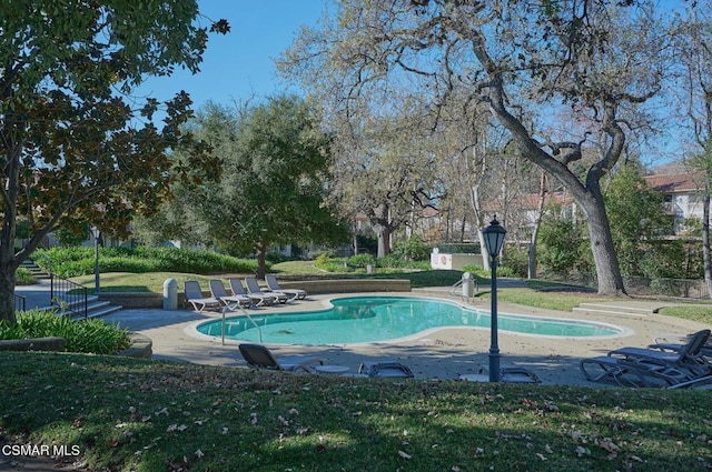 view of swimming pool featuring a patio