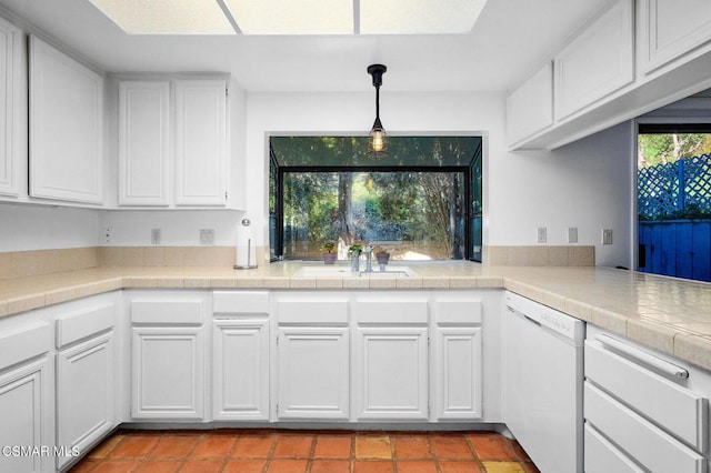 kitchen featuring dishwasher, white cabinetry, and pendant lighting