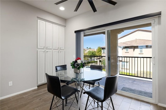 dining space featuring ceiling fan and wood-type flooring