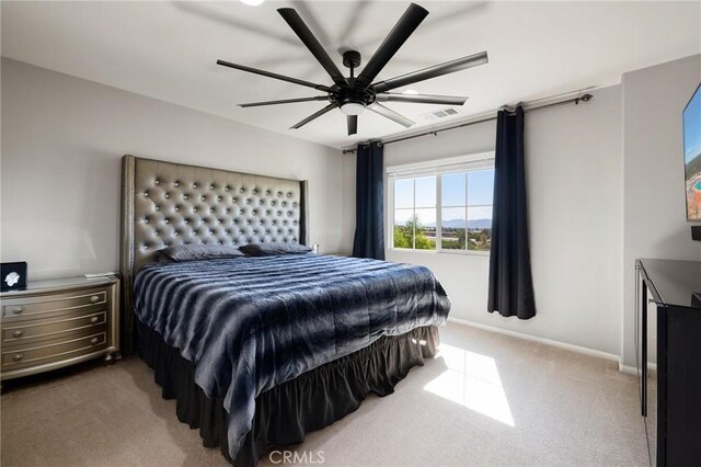 bedroom with ceiling fan and carpet