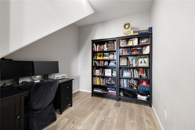 office space with light hardwood / wood-style floors