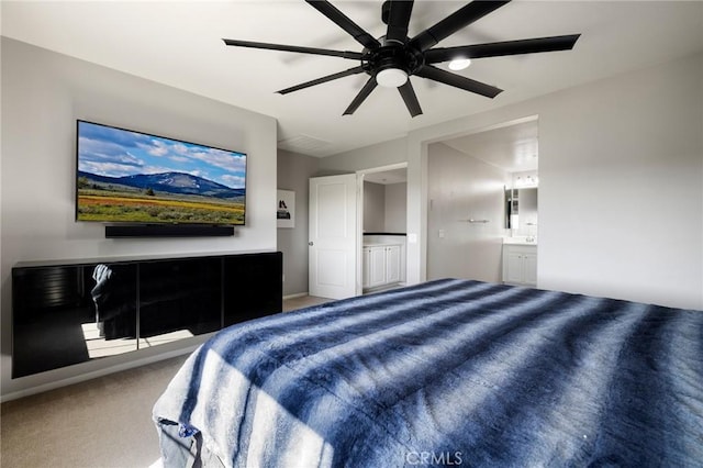 carpeted bedroom featuring ensuite bathroom and ceiling fan