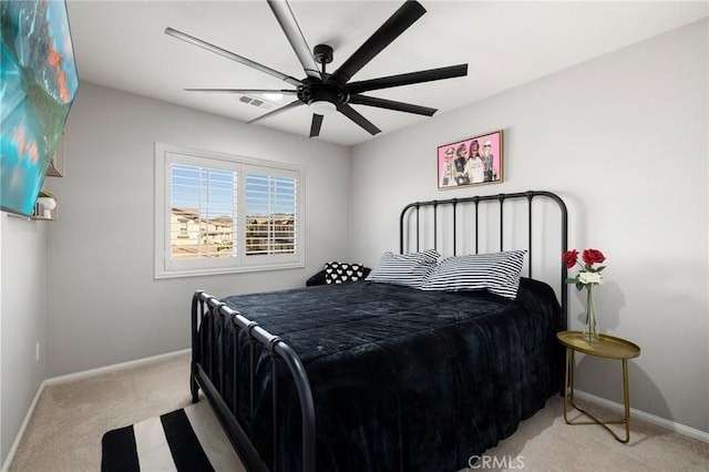 bedroom featuring ceiling fan and light colored carpet