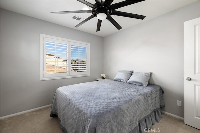 carpeted bedroom with ceiling fan