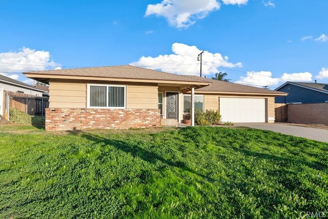 ranch-style home featuring a front lawn and a garage