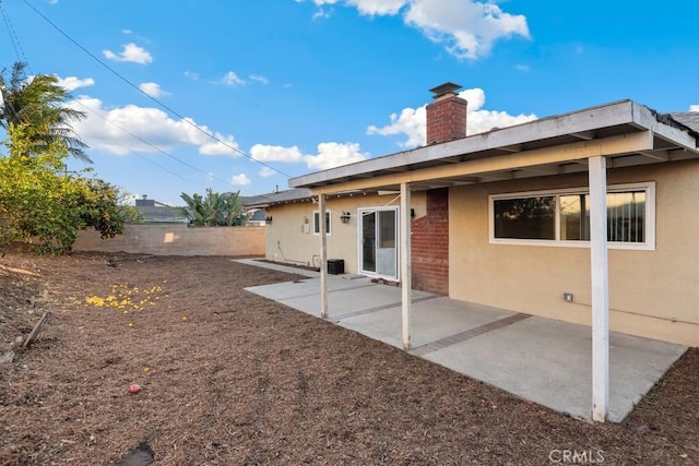 rear view of house featuring a patio