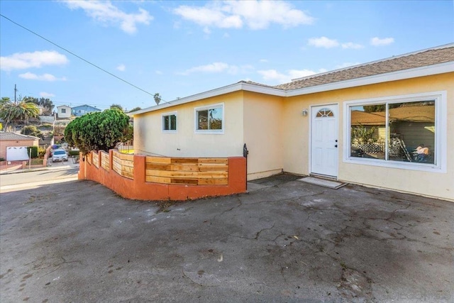 view of side of property featuring a patio