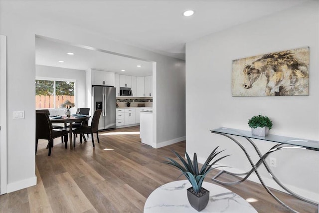 dining room with wood-type flooring