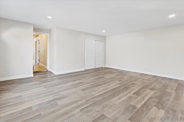 unfurnished room featuring light hardwood / wood-style flooring