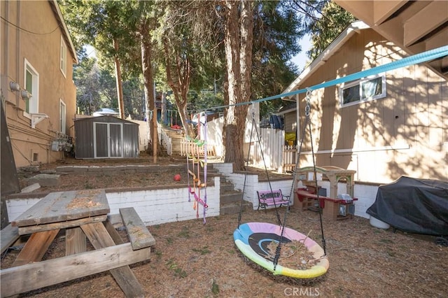 view of yard with a patio area and a storage shed