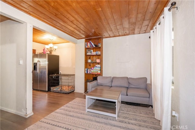 living room featuring an inviting chandelier, wood ceiling, and hardwood / wood-style flooring