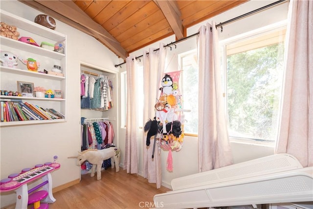 bedroom with multiple windows, wooden ceiling, lofted ceiling with beams, and light wood-type flooring