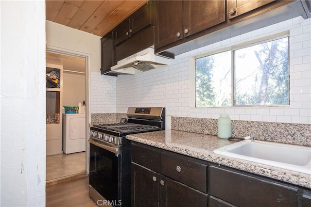 kitchen featuring gas stove, washer / clothes dryer, decorative backsplash, dark brown cabinets, and wood ceiling