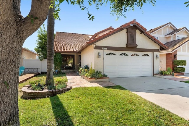 view of front facade featuring a garage and a front yard