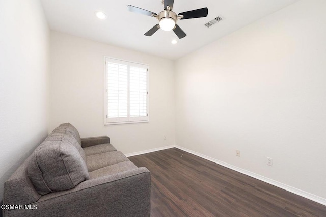 sitting room featuring ceiling fan and dark hardwood / wood-style flooring