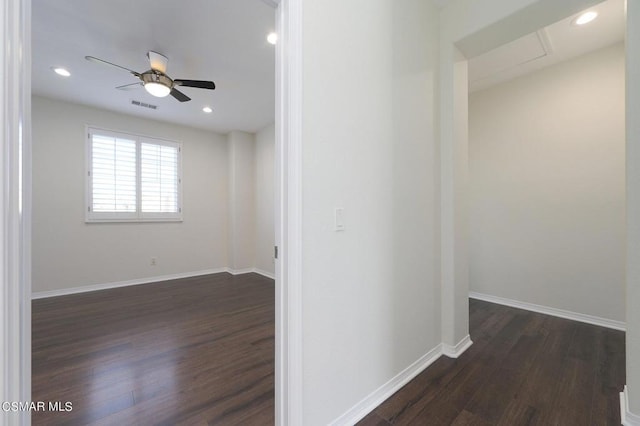 hallway with dark wood-type flooring