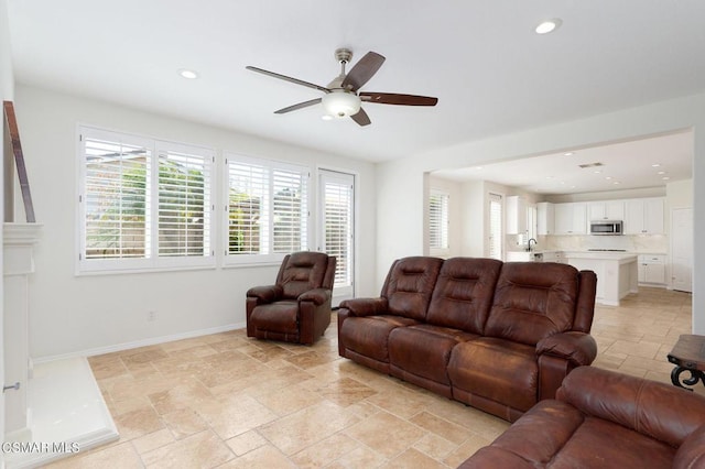 living room featuring ceiling fan