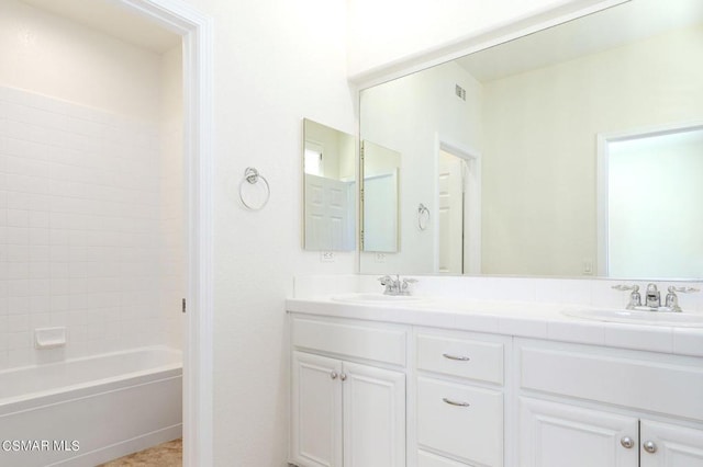 bathroom with bathtub / shower combination and vanity