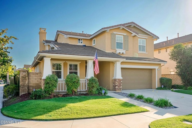 craftsman house with a front yard, covered porch, and a garage