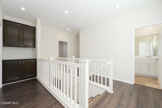 corridor with dark hardwood / wood-style floors