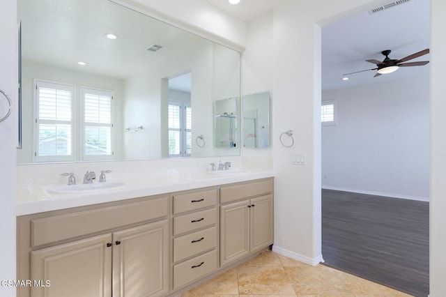 bathroom with ceiling fan, vanity, and tile patterned flooring