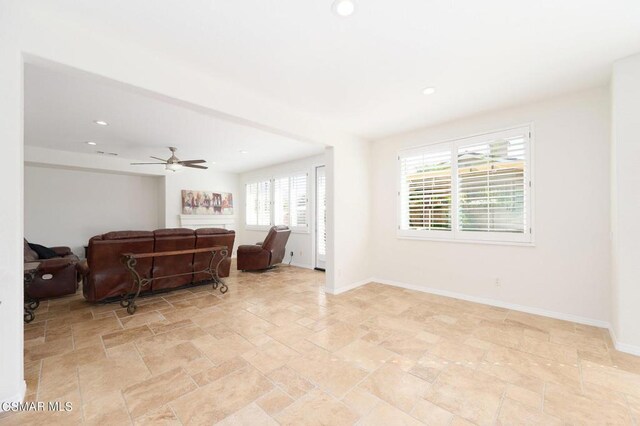 living room featuring ceiling fan