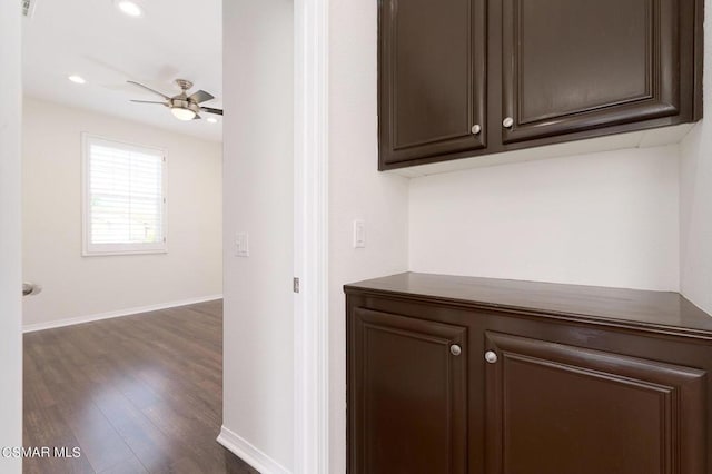 hallway with dark hardwood / wood-style flooring