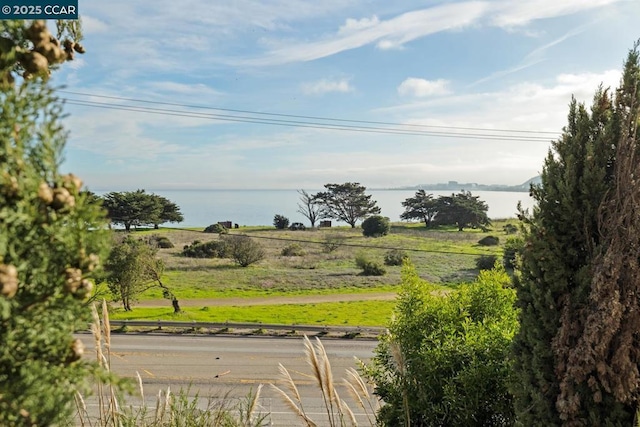 exterior space featuring a rural view and a water view