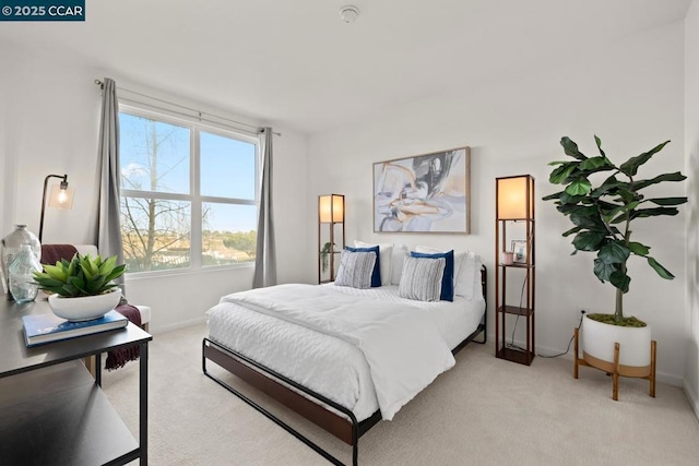 bedroom with light carpet