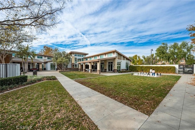 view of property's community with a lawn