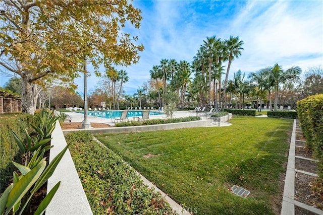 view of yard with a community pool