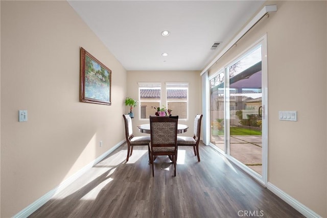 dining room with dark hardwood / wood-style flooring