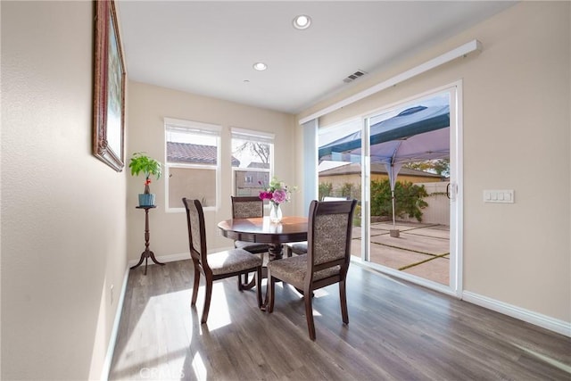 dining space featuring hardwood / wood-style flooring