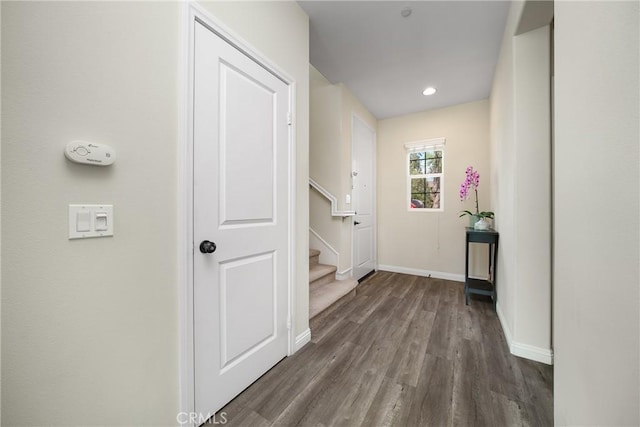 hall with dark hardwood / wood-style floors